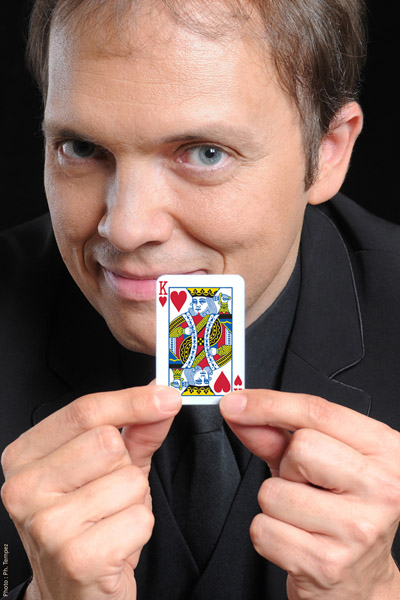 Portrait of French magician Boris Wild with a King of Hearts